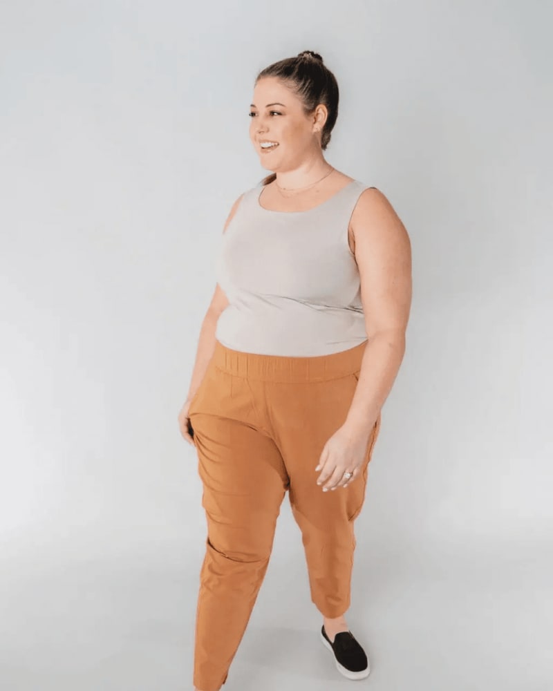 Front of a model wearing a size XL open air pant (28") in camel by alder apparel. | dia_product_style_image_id:300745